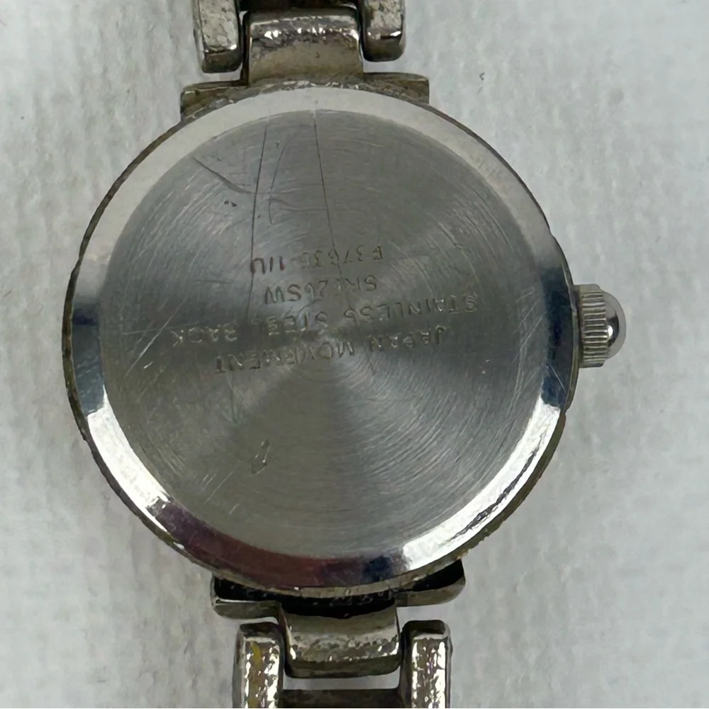Elegant Silver Tone Quartz watch with Pink, Green, Gold and Blue Accents